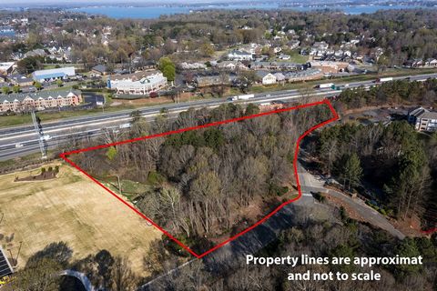 This development opportunity on Holiday Lane in Cornelius NC allows an investor/developer the ability to acquire a prime development parcel in a highly coveted commercial sub-market within the Greater Charlotte Metropolitan Area. The parcel enjoys al...
