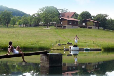 Holiday home with its own recreational lake for swimming and boating. Large playground and direct access to hiking trails.