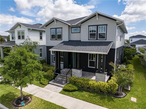 Shows like a model! You will be thoroughly impressed with this beautifully appointed home in Lake Nona’s Laureate Park community. It starts with nice curb appeal – meticulously manicured landscaping and quaint paver front porch greet you upon arrival...