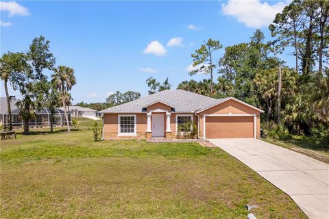 Step inside and be greeted by the warm embrace of this charming home, boasting 3 bedrooms, 2 bathrooms, and a 2-car garage, nestled perfectly within a serene and picturesque neighborhood in the heart of the fast growing North Port! Sitting on an OVER...
