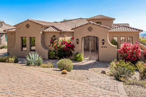 Custom home in a gated golf course community, nestled on a premium cul-de-sac lot with stunning city and mountain views. This beautiful single story 5 bed 3.5 bath home is an entertainer's dream. The exterior space offers a covered patio, with automa...