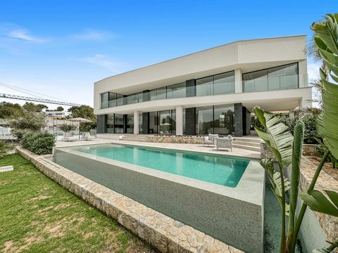 This modern new build is located in a quiet area of Cala Vinyes and opposite a green zone. The villa, built in a minimalist style, is spacious and bright. On the first floor is the open-plan living/dining area with cooking island, which is directly c...
