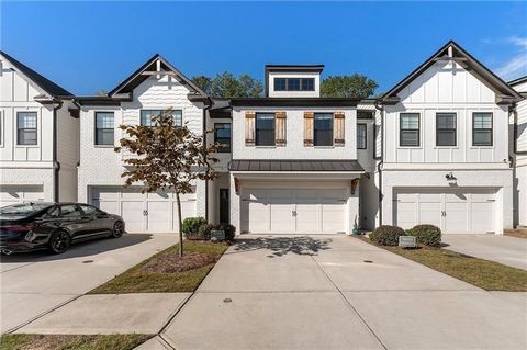 Welcome to this stunning 3-bedroom, 2.5-bath farmhouse-style townhome in the gated community of The Townes of Auburn. This home features a bright, open floor plan with hardwood floors throughout the main level, a beautiful kitchen complete with quart...