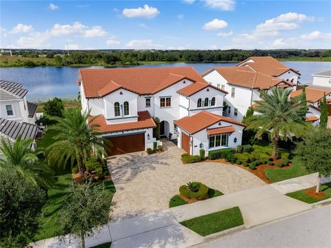 Welcome to your new Lifestyle at 15687 Panther Lake Dr, Winter Garden, FL 34787! Presenting the Bramante Spanish Colonial Estate, a masterpiece by the award-winning builder Toll Brothers, setting the standard for luxury and sophistication in the high...