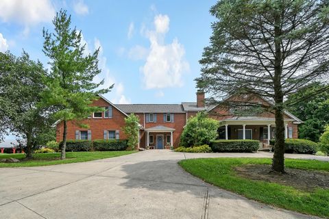Infinite possibilities for this three-residence estate situated on 100.9 acres. The main all brick residence perfect for indoor and outdoor entertaining is complete with 5 bedrooms including a massive first floor Owner's suite. Hickory floors through...