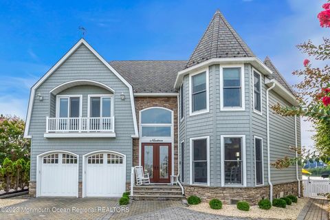 Welcome to 19 Captains Court, your luxurious coastal retreat in the heart of Manasquan, New Jersey. This exquisite three-story residence, boasting 4,800 square feet of living space, offers a seamless blend of elegance and functionality within a stunn...