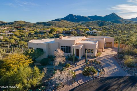 Located in the highly desirable gated, westside neighborhood, this custom southwestern contemporary split-level home sits on 2+acre saguaro studded hillside cul-de-sac lot w/breathtaking views from every window & patio. Beautiful Jos Villabrille mura...