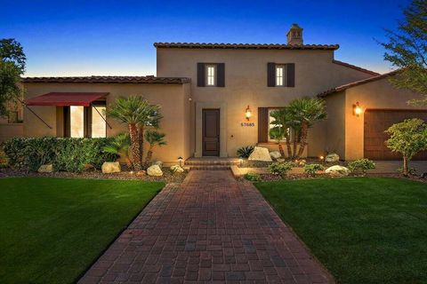 Understated Elegance describes this impressive Spanish Mediterranean Style SINGLE STORY with Soaring ceilings. As you enter the front door be prepared to be dazzled by the architectural design of arched doorways, crown molding. 3 fireplaces, built-in...