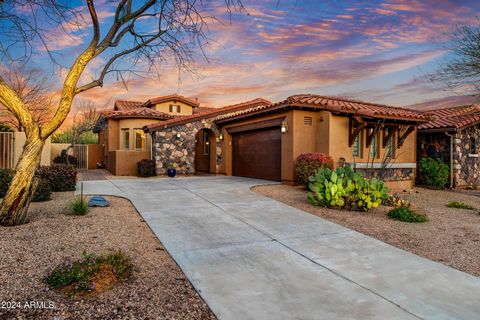 Discover the epitome of lock-and-leave living in Solstice at Sevano, a gated community. Nestled against protected natural area open space and Whisper Rock golf course, this prime unit boasts stunning views of Winfield Mountain Preserve. Enjoy exclusi...