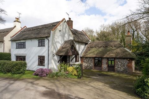 This attractive thatched cottage sits in glorious surroundings, down a quiet no-through lane with open fields to the front and woodland to the rear. Secluded and peaceful, it feels like a real retreat, yet it’s just down the road from a riverside vil...
