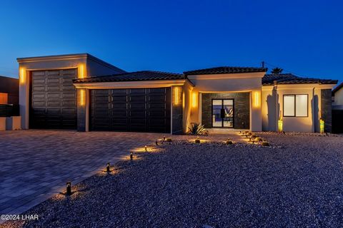This modern home features sleek lines, large accordion windows that opens from Kitchen and Dining area to the pool and covered patio to create a show stopping open flow from the inside to the outside of the home. Take a refreshing dip or lounging poo...