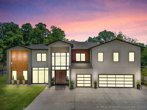 Unrivaled modern luxury in this exquisite, privately gated home in Midtown Tulsa sitting on 77-acre! Artfully designed by the renowned architectural designer, Atria Design Studios, new elegant designer furnishings and rugs are INCLUDED as an inclusiv...