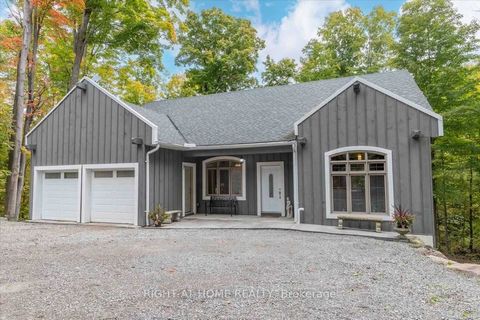 Discover tranquility in this stunning custom-built ranch-style bungalow, nestled on over 2.5 acres in beautiful rural Coldwater! This charming home features a lower-level in-law suite, perfect for family gatherings or hosting friends. Step inside to ...