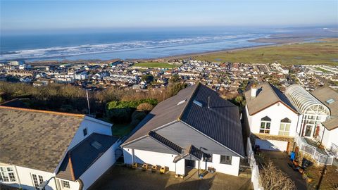 'The Navatek' is a custom-designed executive residence, perfectly positioned on an elevated site offering breathtaking views of Westward Ho! beach, the Northam Burrows Nature Reserve, and extending toward Saunton Sands. The property also boasts unint...