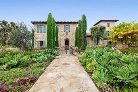 A majestic Tuscan idyll set on an extraordinary corner plot where breathtaking vistas and private seclusion go hand in hand. Situated in the renowned enclave of guard gated Shady Canyon and constructed with a discerning eye. Melding traditional forma...