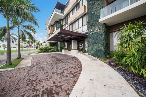 This exceptional luxury condo at the Garden Apartments in Ocean Reef offers a sleek, modern design with premium finishes throughout. The spacious layout seamlessly integrates indoor and outdoor living spaces, featuring expansive views of the marina a...