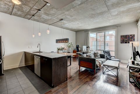 Quai des Éclusiers -- Impeccable condo featuring a closed master bedroom with windows, offering both comfort and privacy. The open-concept layout includes a modern kitchen with oversized island that flows seamlessly into the living space. The spaciou...