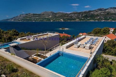 Two exclusive newly built villas with sea view are for sale. They are located in a small coastal town on the island of Korčula, just 50 meters from the crystal clear sea and a beautiful pebble beach. Each villa has four floors connected by a combinat...