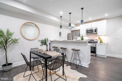 Welcome to 1421 Holbrook Street Unit A, a stunning 2-level condo in the heart of Northeast Washington DC. This exceptional residence boasts 3- bedrooms, 3 and a half bathrooms of luxurious living space. As you come off the quiet private porch into th...