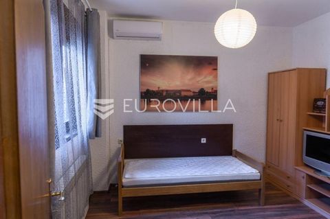 Osijek, Center, Radićeva street, apartment 66 m2. The apartment consists of two rooms (13 m2 and 27 m2) and a small kitchen (11 m2) and a bathroom (5 m2). The apartment is equipped. The heating is from the city (heating plant). There are tiles and la...