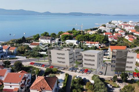 Zadar, Sukošan, penthouse in a building with a total of six apartments. Building C, apartment S6 consists of an entrance hall, two bedrooms, bathroom, open concept kitchen, dining room and living room, laundry room, balcony and roof terrace of 105.92...