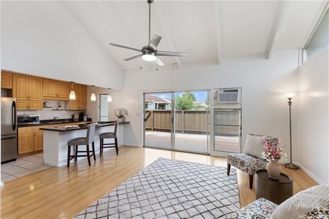 Welcome to this charming, well-maintained townhome nestled in the serene Mililani neighborhood. This freshly painted and rarely available end unit consists of a spacious living area with high windows and ceilings, creating a bright and open atmospher...