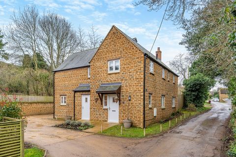 A detached stone built village house tucked away down a quiet lane in this small and popular village. Built in 2019, the property benefits form air source heating and full double glazing. Includes a spacious hall, cosy lounge with wood burner, WC, ut...