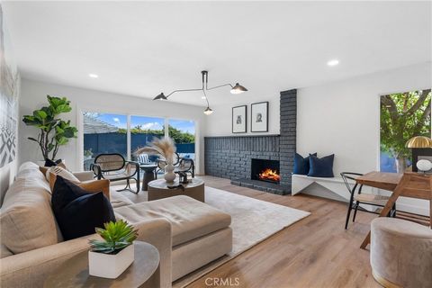Discover OC coastal living at its finest in this completely reimagined two-story home with a coveted three car garage in the heart of Huntington Beach. Boasting four bedrooms and two and a half fully upgraded bathrooms, this open concept residence ex...