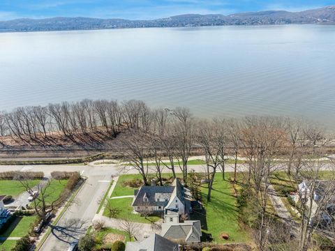 Riverfront storybook Tudor within the Philipse Manor Sleepy Hollow community with rights to a private beach and boat club. Set on 0.41 acres with a (buildable) side lot - perfect for a large garden party. Watch sailboats and tugboats come by during t...
