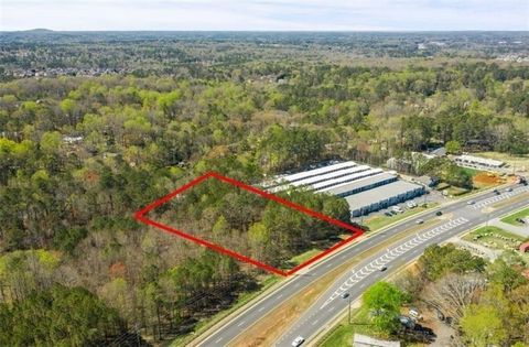 Discover the potential of Parcel ID 21N12 182, a prime 1.87-acre undeveloped land located on the bustling Highway 92 corridor in Acworth, GA. It sits adjacent to Midgard Self Storage at 5534 Hwy 92, Acworth, GA, midway between I-75 and I-575 - less t...