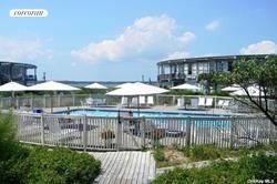 Round Dune is a 76 unit, oceanfront co-op on Dune Road in East Quogue. Unit B14 is a second story, west facing, second floor, open plan studio unit with murphy bed, and deck for those gorgeous sunsets over the bay. Enjoy your private ocean beach, hea...