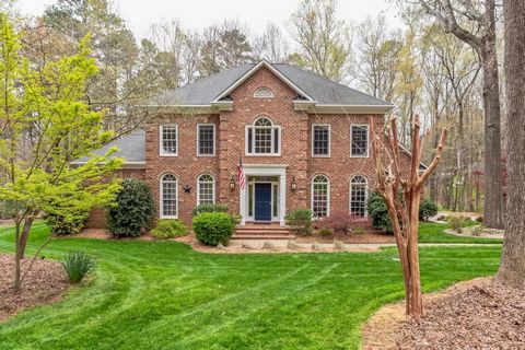 Experience serenity in this classic, custom-built Weddington home sitting on an impeccably landscaped 1.6 acre lot. Step into elegance through the 2-story foyer with stunning staircase and formal dining room adorned with palladium windows and rich mo...