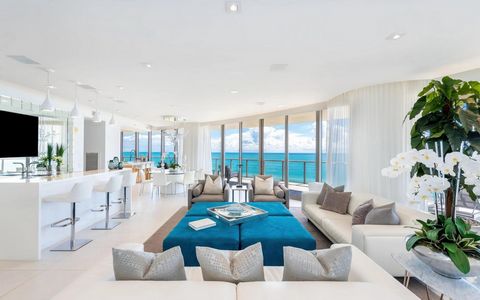 Located in Florida, this luxurious condo offers stunning 180-degree ocean views and exclusive access to a full range of amenities. With its bright and modern interior, high ceilings, and open floor plan, this space is perfect for entertaining and ent...
