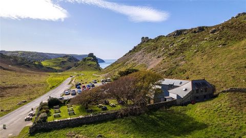LOCATION Surrounded by dramatic scenery and breath-taking views. Immersed into the landscape, in a dramatic Exmoor Valley setting that follows the contours of coast, next to a public car park on one side and on the other side is probably one of the m...