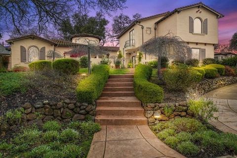 Behind the guarded gates in the prestigious Serrano Golf and Country Club neighborhood is this beautiful 4,766 sq ft Tuscan-inspired estate. Pass through the large courtyard with a classic Italian fountain to the entry, where you will notice the 18-f...