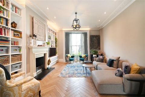 This impressive three-bedroom duplex apartment occupies the ground and lower-ground floors of a smart period building and has been sensitively updated providing contemporary interior design and a functional layout.