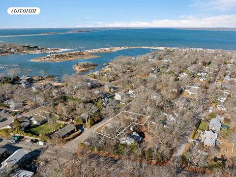 All offers considered! Large lot in waterfront neighborhood of Pine Neck, Sag Harbor. 1/4 acre with existing structures. 1,220 house and 2 car garage. Room for pool! Tear down or renovate. Circle Beach, Cromer's grocery, restaurants and shops located...