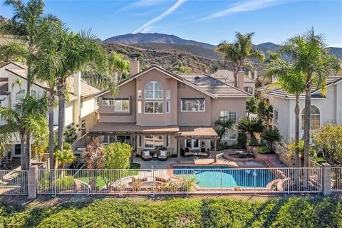 The most breathtaking views that stretch all the way to Catalina! This stunning 4-bedroom, 2.5-bath POOL home is in the exclusive Promontory Tract of Trabuco Highlands in Robinson Ranch. Perched high above most other homes, it offers unparalleled pan...