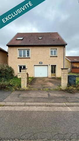 Maison 5 chambres avec garage et jardin.