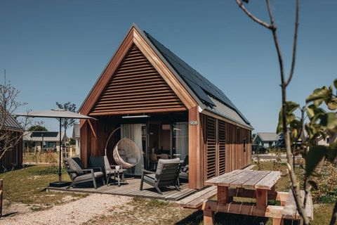 These modern tiny houses are located in the large-scale holiday park Beach Resort Nieuwvliet-Bad, close to various well-known seaside resorts in Zeeland, 16 km from Knokke and about 500 m from the beach. The tiny house is furnished in a modern and co...