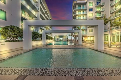 Own a piece of Miami's vibrant Design District with this stunning condo-hotel unit. Experience the ultimate blend of luxury and convenience with this turnkey property. As you enter, you'll be greeted by sleek ceramic floors. The kitchen is a chef's d...