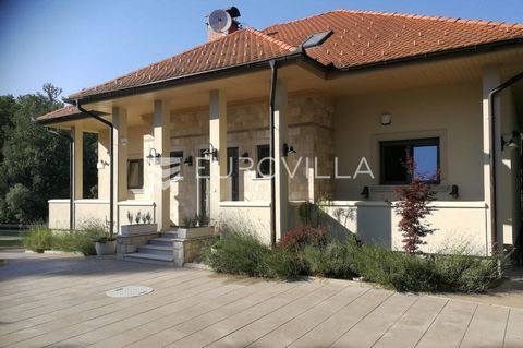 Ozalj, Kamanje, a beautiful newly built family villa next to the Kupa river itself. Area 580m2 located on a plot of 1,600m2. The house is divided into 3 floors. Basement: tavern with open fireplace, wine cellar, apartment, kitchen with dining room, b...