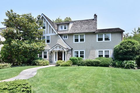Welcome to this elegant sun-drenched, 5-bedroom English Country home nestled on a quiet cul-de-sac. Built in 1915, this timeless residence boasts perfect proportions and classic charm. The expansive, beautifully landscaped flat yard flourishes with b...