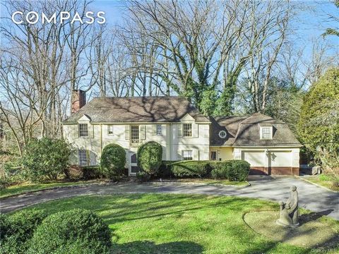 Discover park-like grounds, scenic views & endless possibilities on this extraordinary 0.62-acre Fox Meadow property just a stones throw from Scarsdale high school and village. With an impressive circular driveway, this elegant 1930's classic colonia...