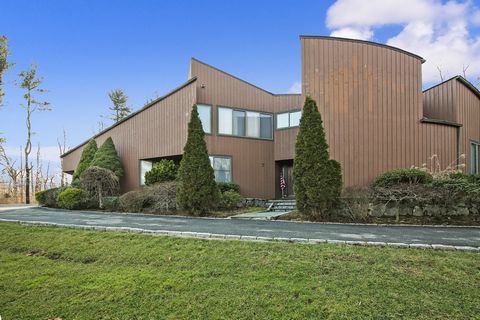 Stunning, sun-filled Contemporary home with open floor plan, high ceilings and sunny skylights. This sprawling five-bedroom home offers endless space and privacy both inside and out. This is truly a forever home with such features as a large family r...
