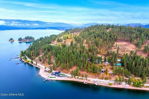 Lake Pend Oreille water frontage on pristine sun-drenched Sunnyside. 182' of private beach stretches across 2 parcels allowing the potential for up to 1400 sq.ft of docking. There is currently a dock and boat lift, storage shed, and an endless supply...