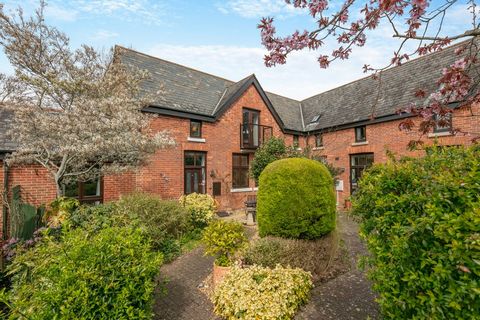 Stepping in through the front door, the entrance hall has exposed beams, a staircase to the first floor living space and a hallway to three en-suite double bedrooms, all of which are on the ground floor. The incredibly spacious reception room has man...