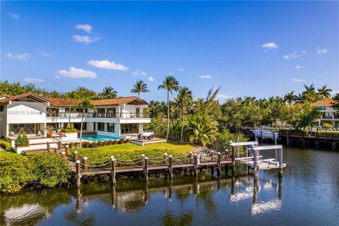 Be amazed by the breathtaking water views from this home with over 300 feet waterfront in Islands of Cocoplum. The spacious driveway leads to a secluded setting for this home with ample spaces overlooking the water views. First floor features formal ...