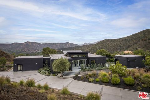 Experience a harmonious blend of curated design and outdoor aesthetics in this recently constructed architectural masterpiece. Set on nearly 10 acres with breathtaking views, this home features the finest materials, appliances, and finishes available...