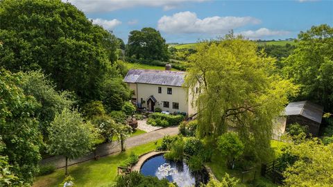 Priest Cottage is a beautiful Grade II listed Devon longhouse with a rich history, believed to date back to the 17th century. The property features remarkable historic carpentry and includes five bedrooms, three reception rooms, stables, and several ...